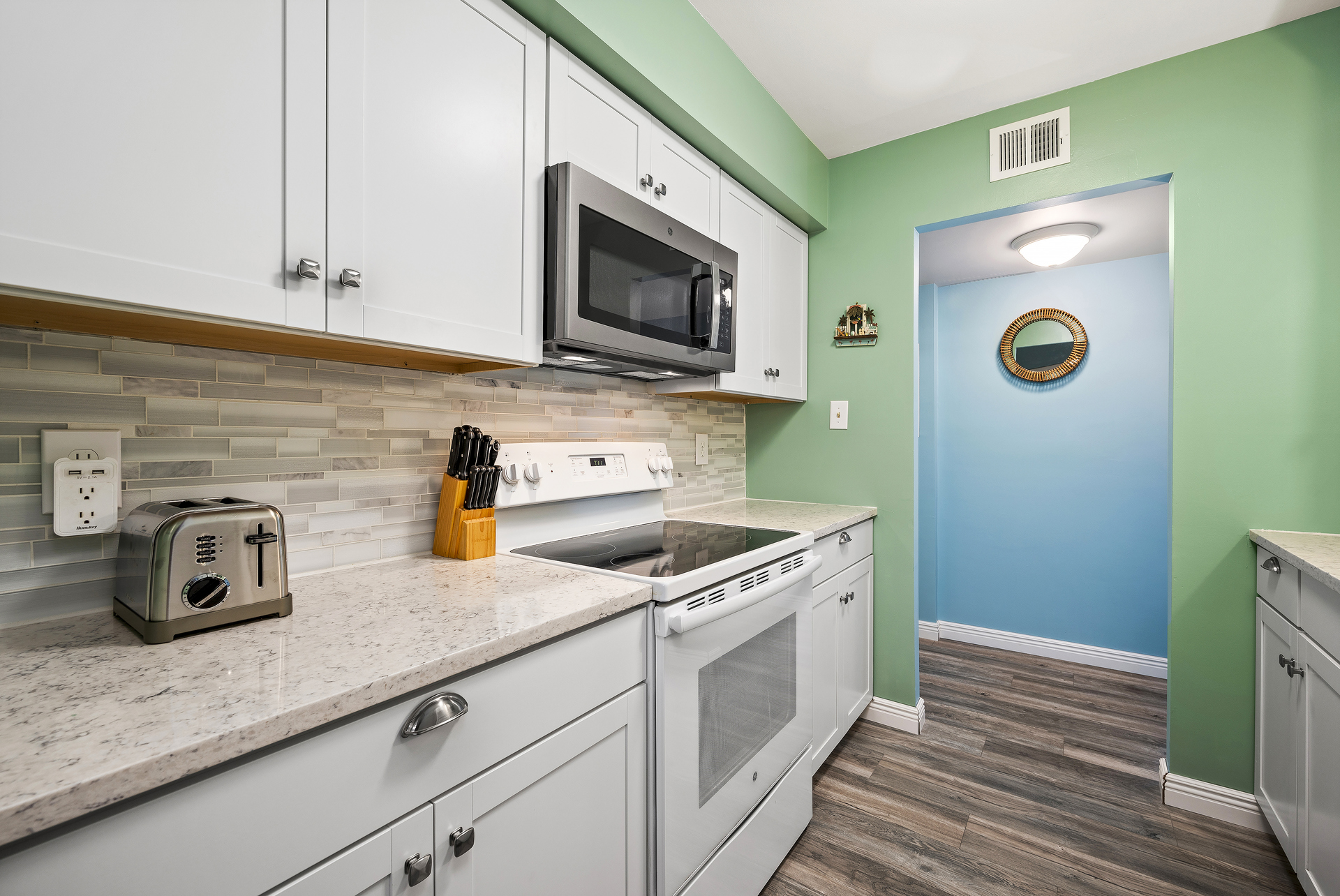 Well-Stocked Kitchen has gleaming granite and a stunning new Backsplash.