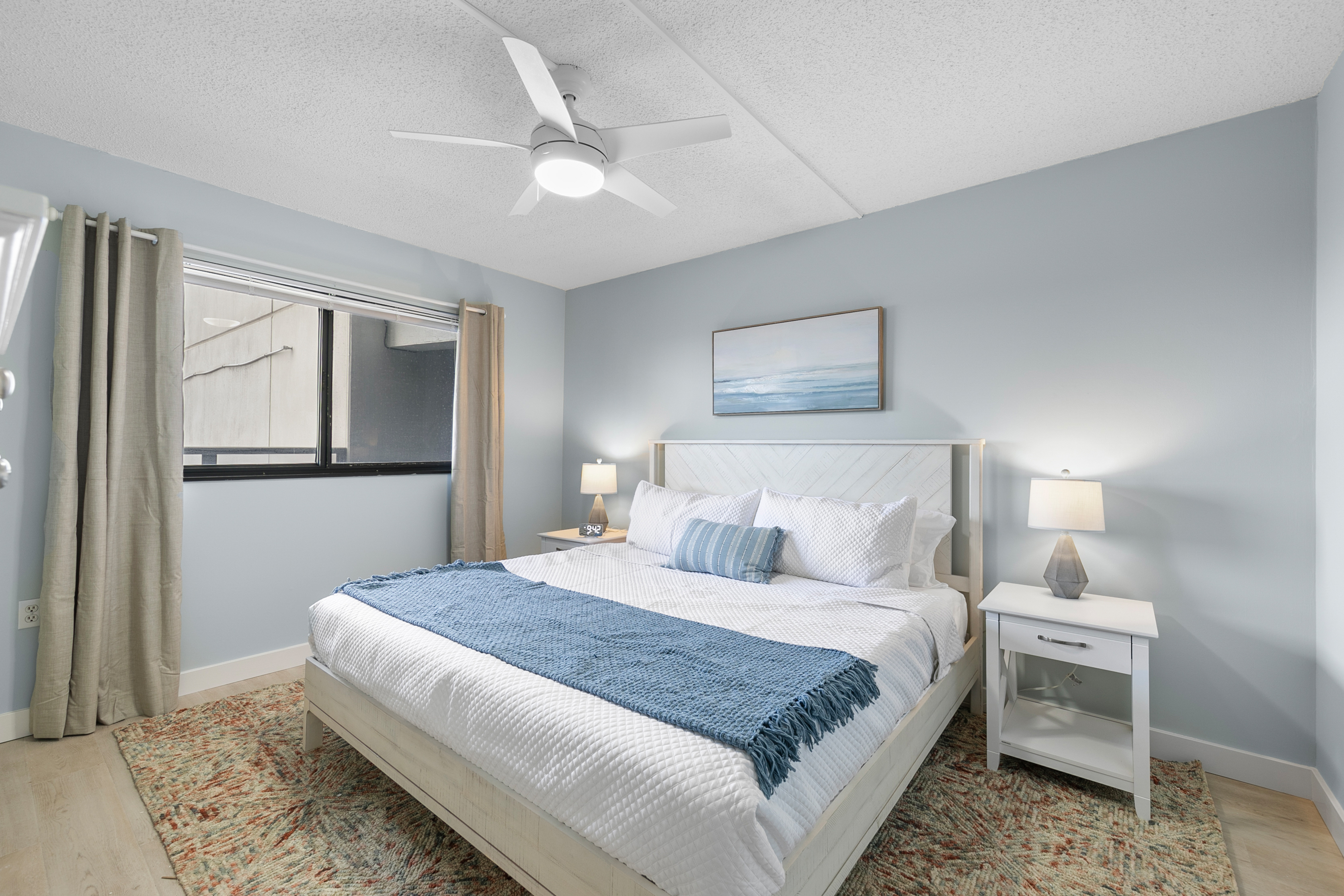 The Primary Bedroom features a plush King Bed!