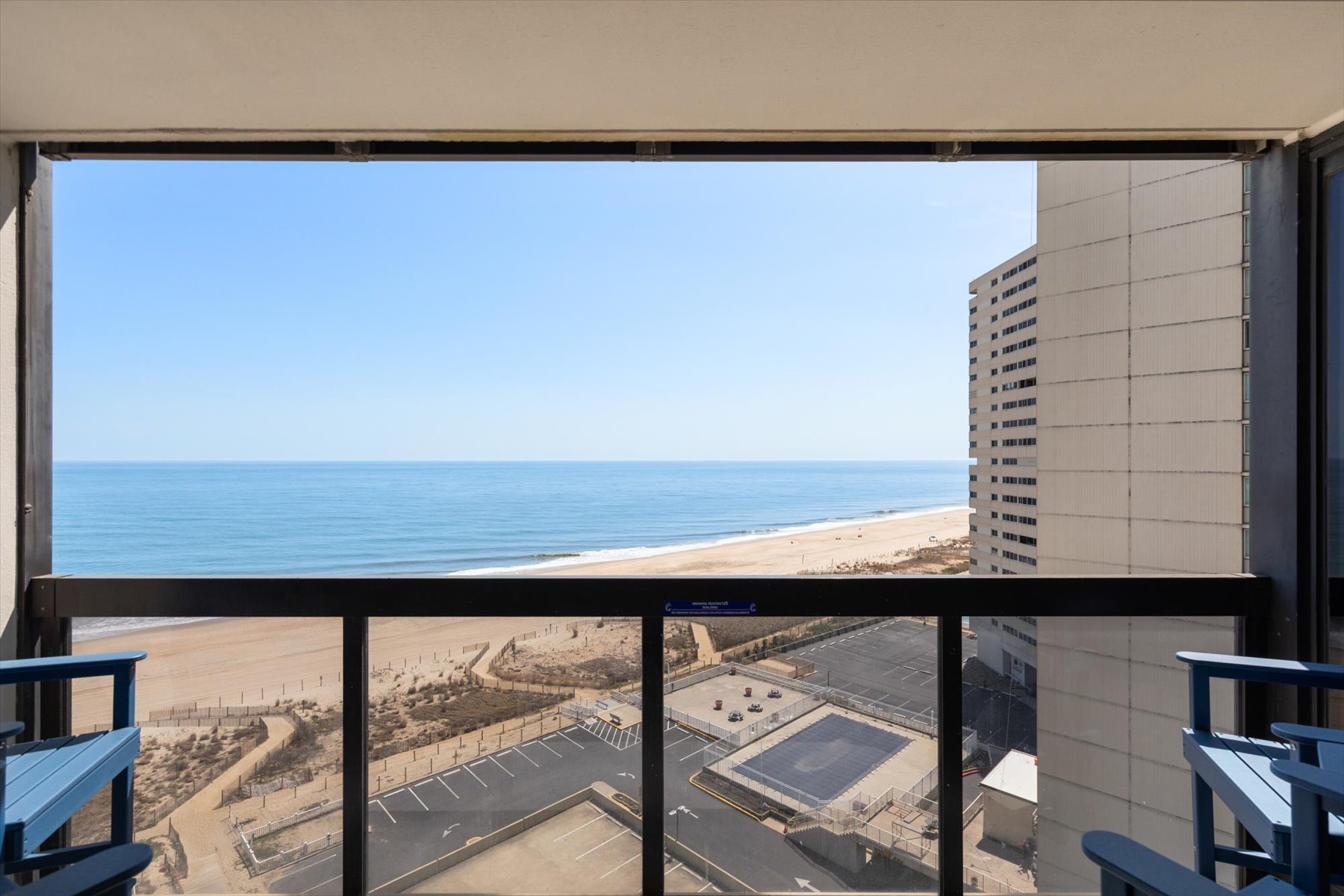 Glass railings preserve the captivating ocean view.