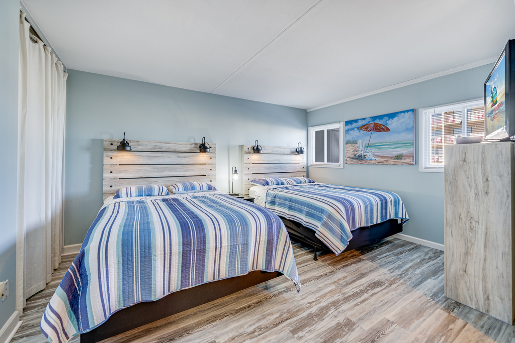 The primary bedroom offers 2 luxurious Queen Beds.