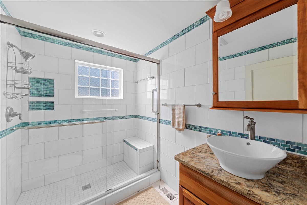 Gorgeous Full Bath with Custom Tile and Walk-in Shower on 1st Floor.