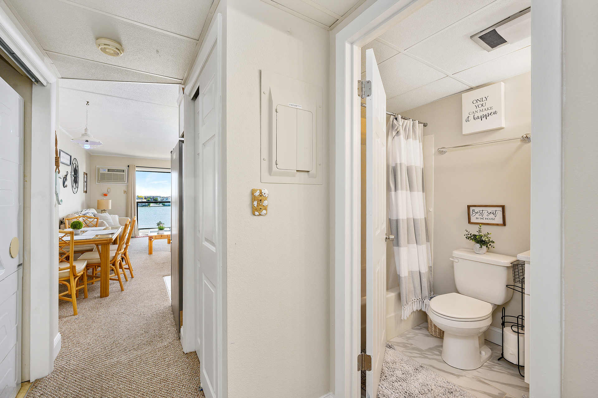 Cozy entrance leading to a dining area that captures a serene view of the bay