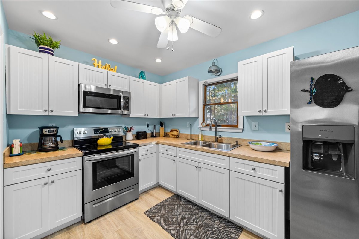 Beachy Blue Walls and White Cabinetry.