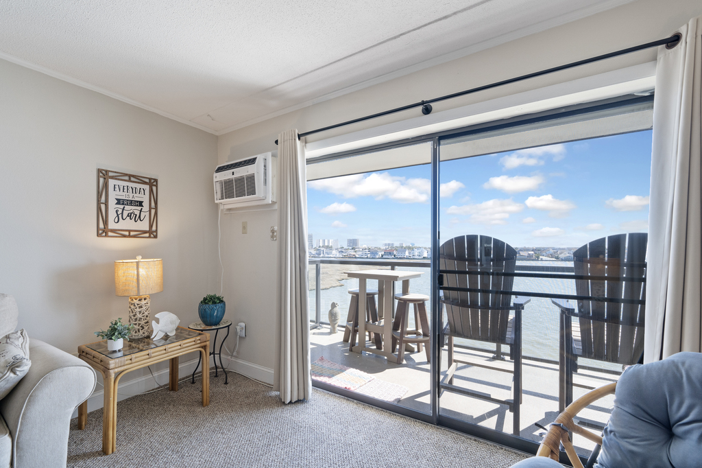 The living room gives way to the unparalleled private balcony with wide open bay views
