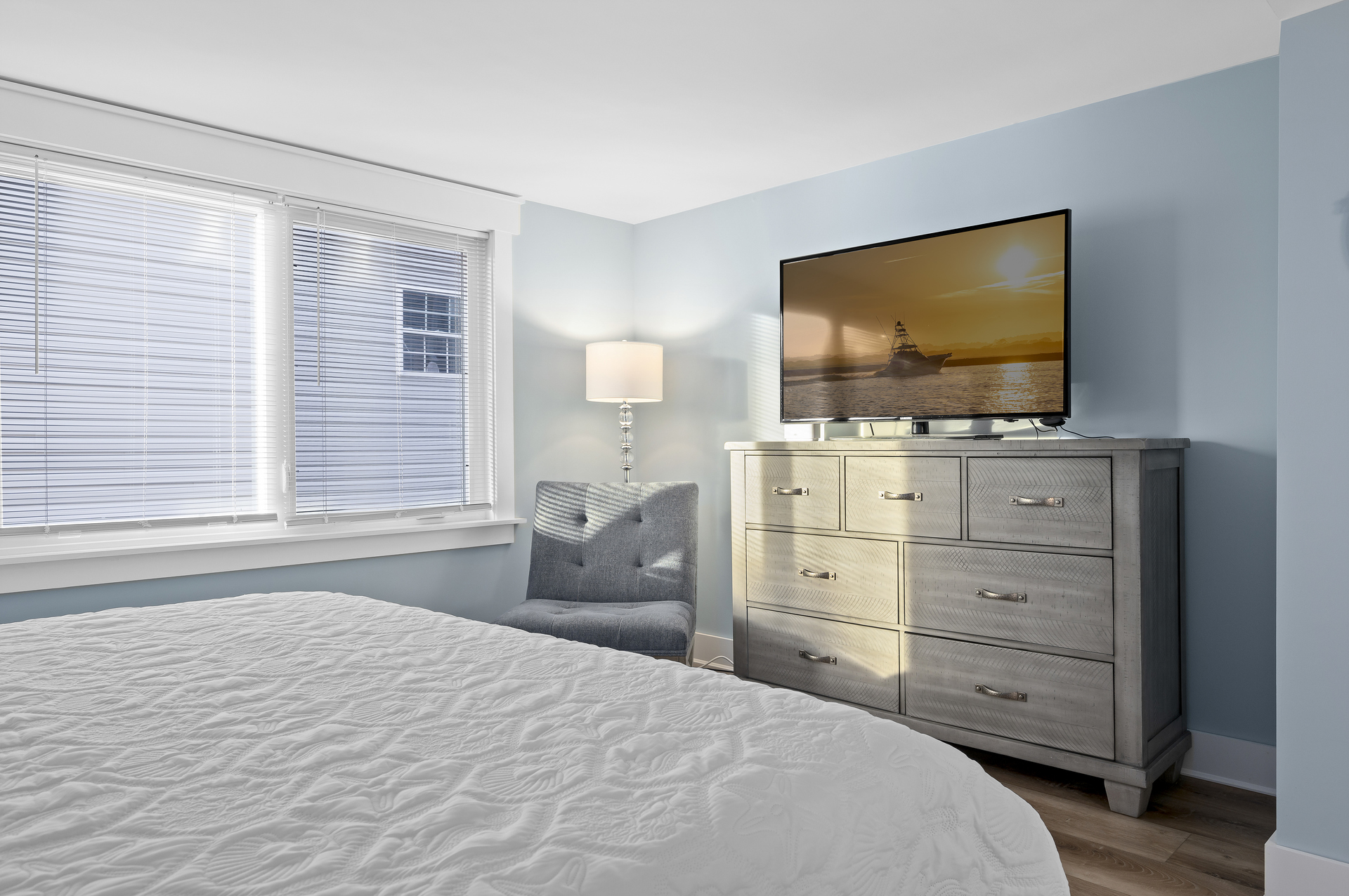 Beautiful blues and Flat Screen TV in Primary.