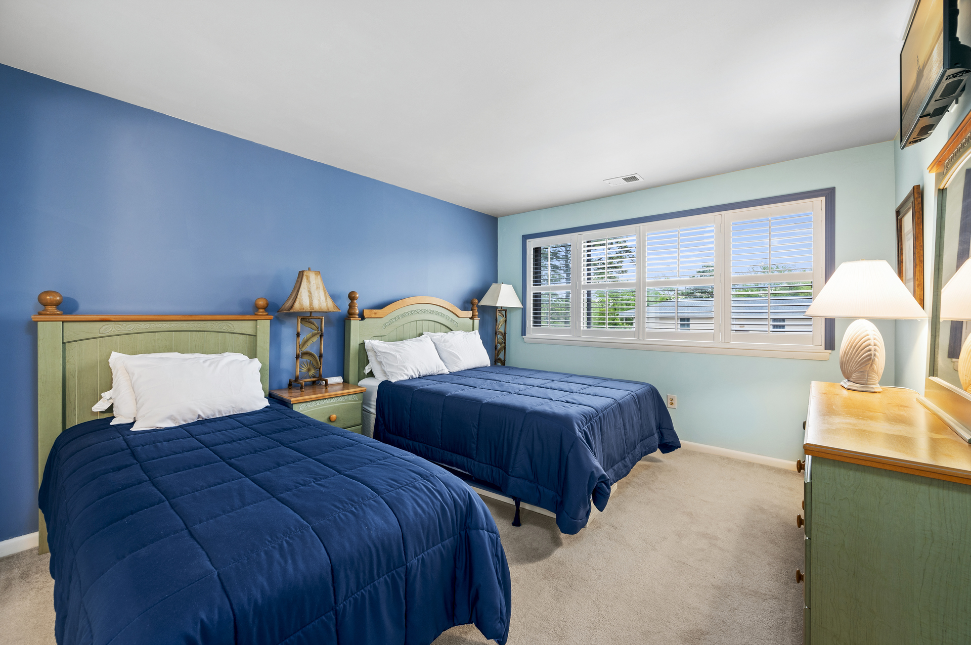 Bedroom 2 has a Queen Bed and a Twin Bed.