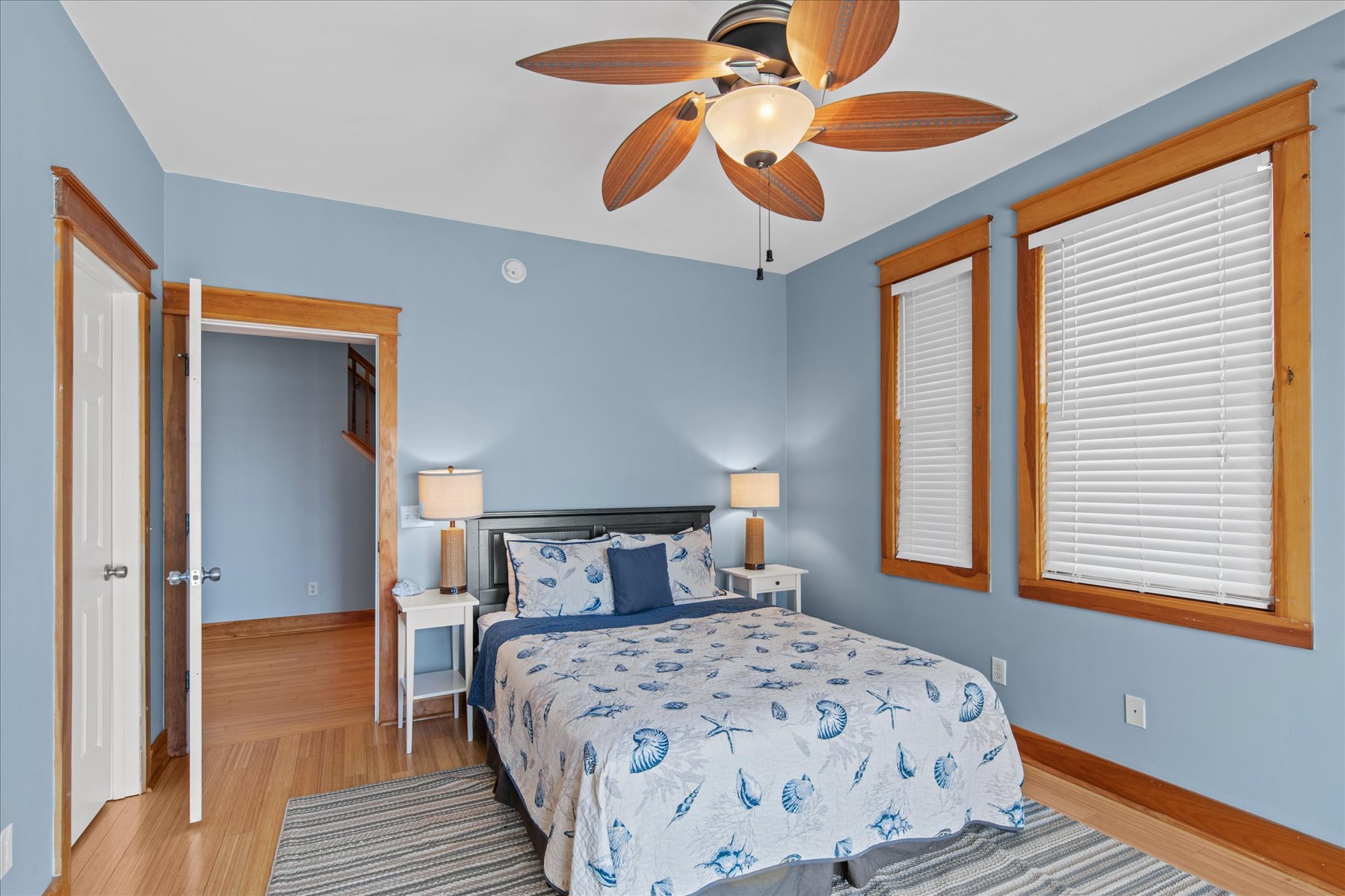 Bedroom 2 has a Queen Bed and beachy blues.