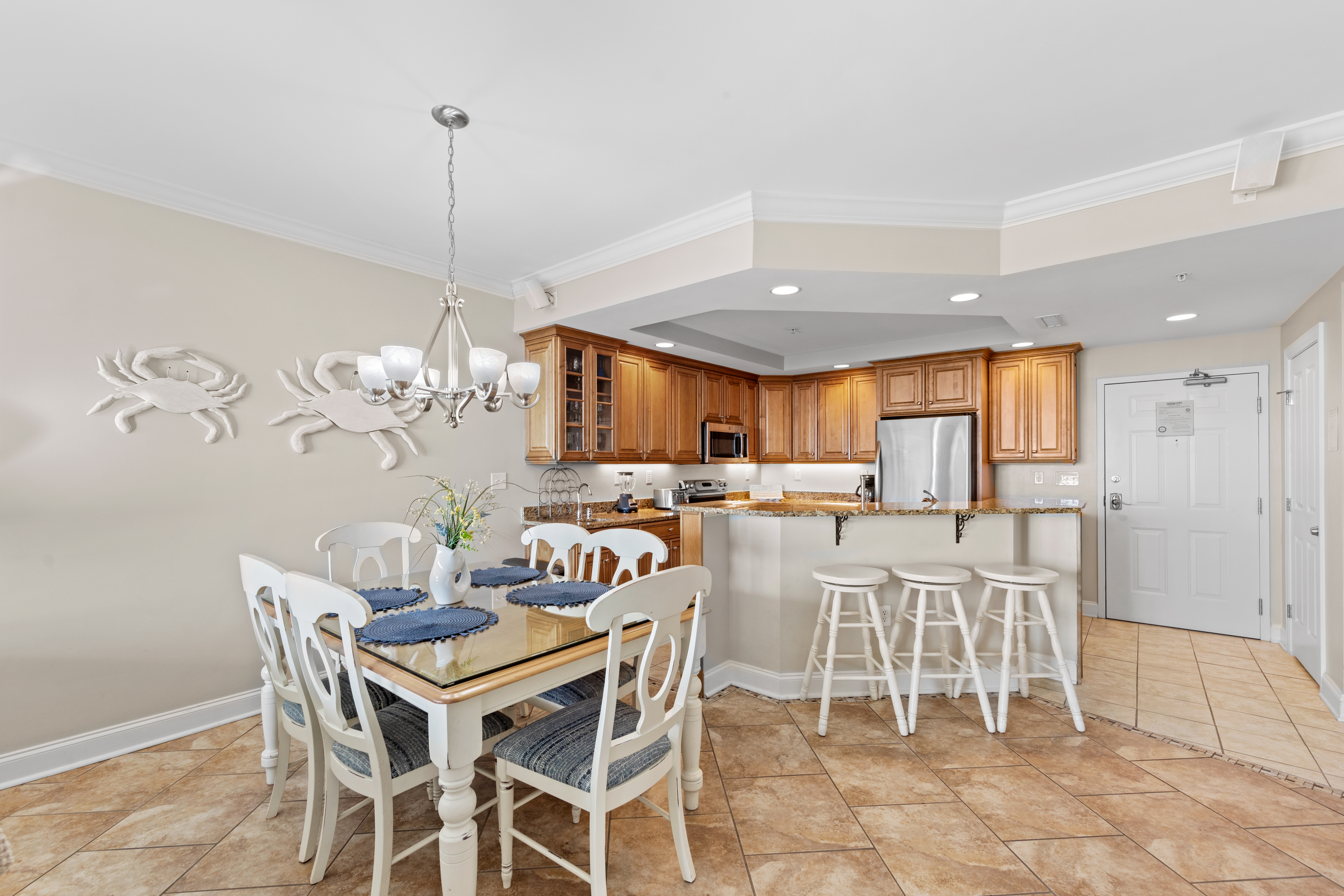 Just off the Kitchen, you’ll find the dining space with table and seating at the Breakfast Bar.