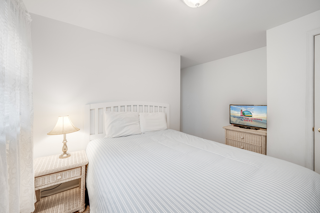 Bedroom 2 also has a Queen Bed and Flat Screen TV.