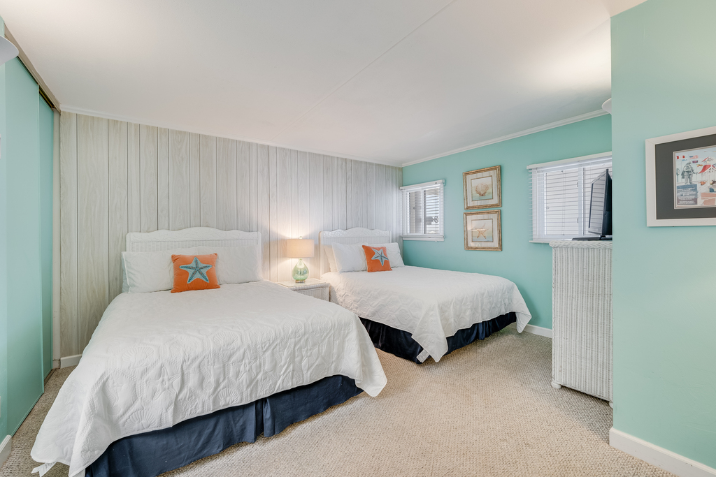 The Bedroom has 2 Plush Queen Beds.