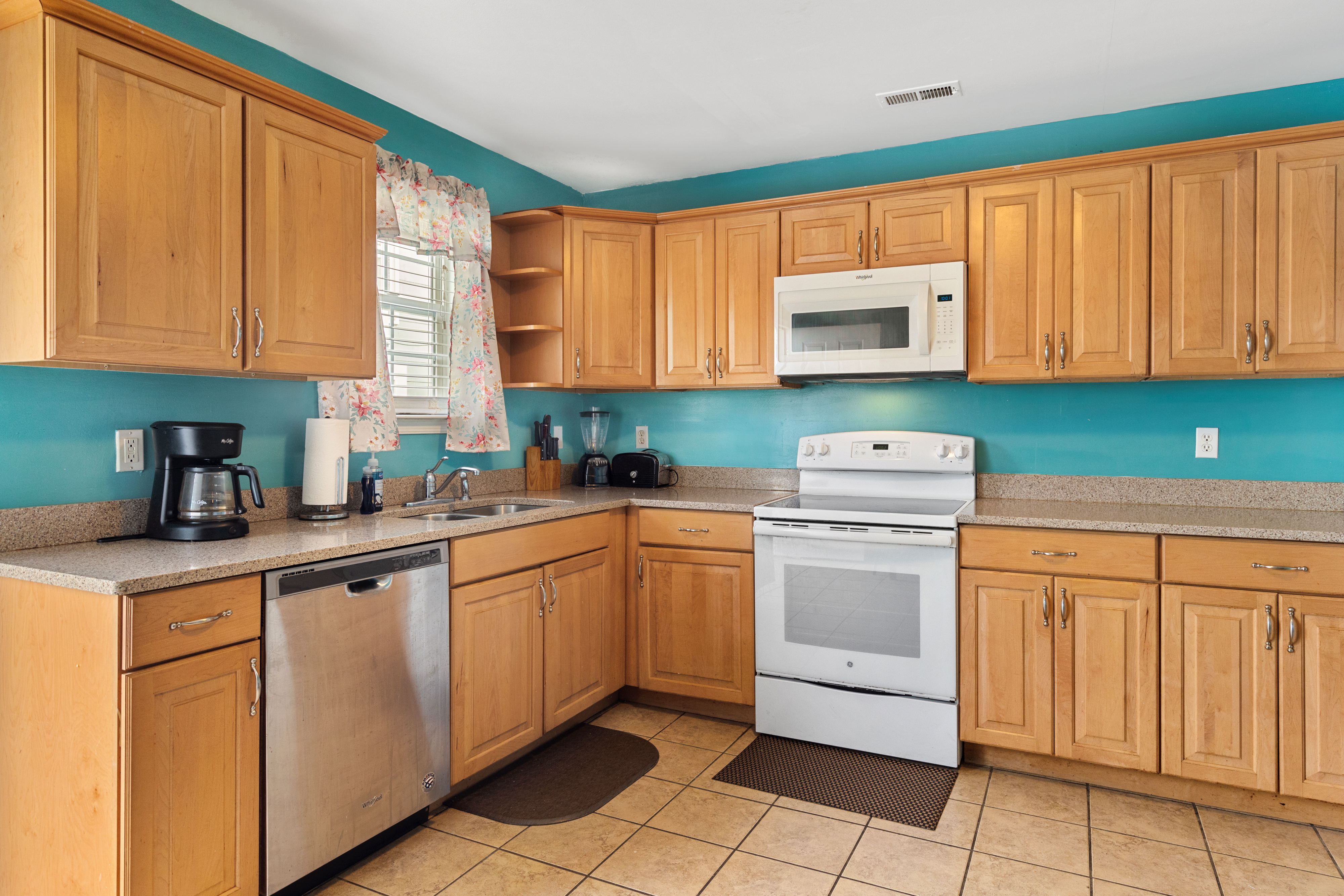 Plenty of counter space and storage with the solid wood cabinets in this kitchen.
