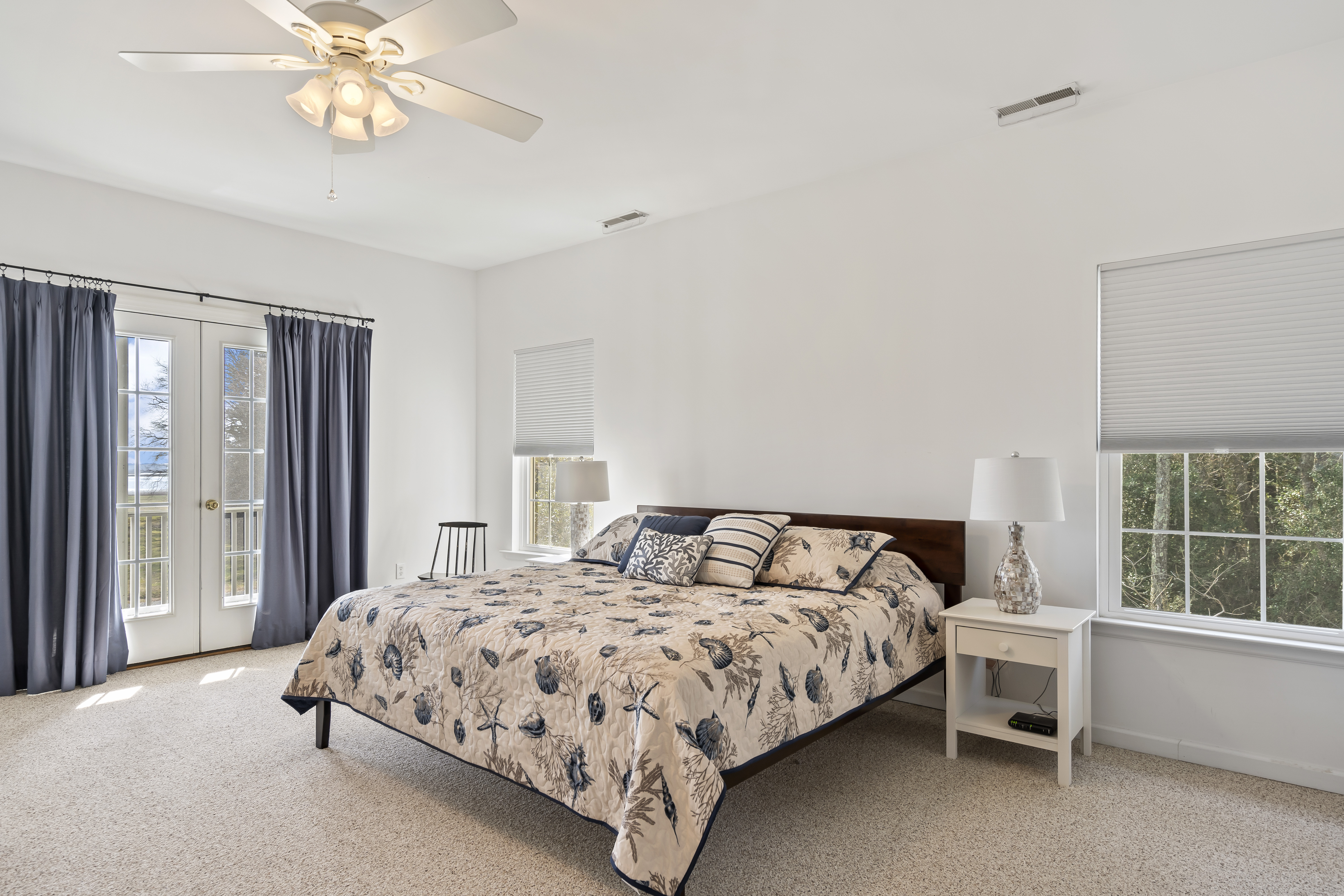 Upstairs, the Master Bedroom has a King Bed and French Doors leading to a Huge Water View Deck.