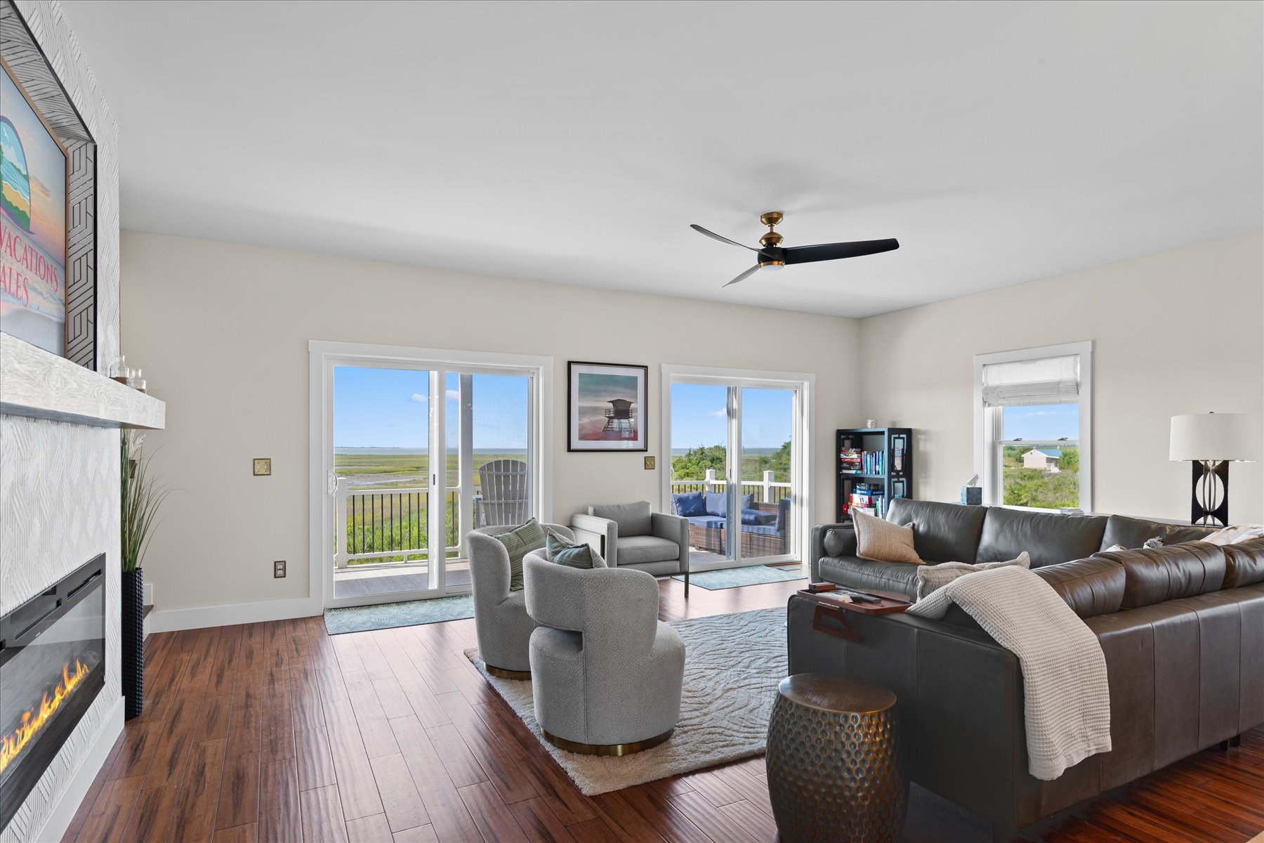 A wall of windows to the water invites amazing Views into this home.