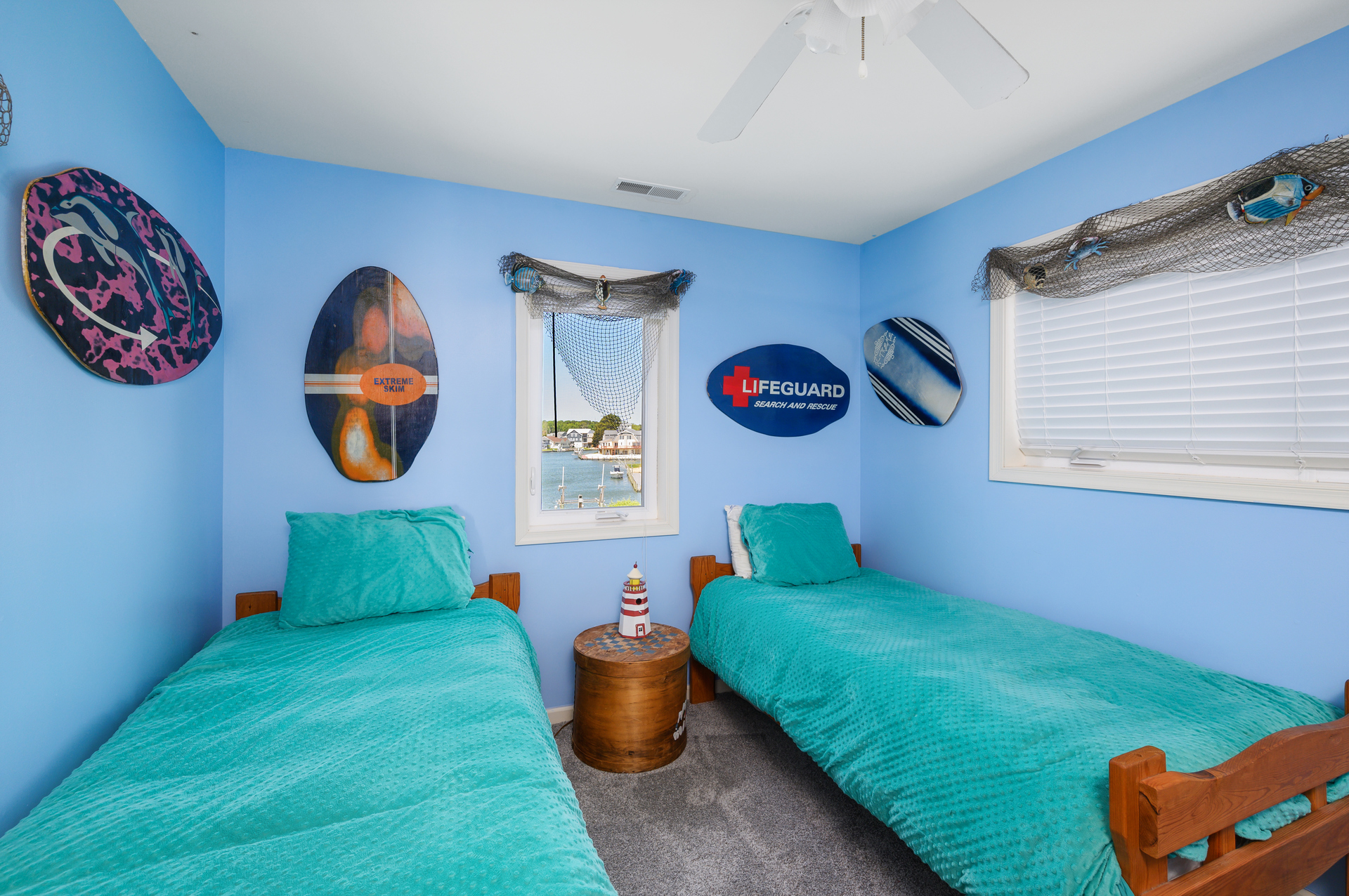 Bedroom 4 has 2 Twins and is bright and beachy.