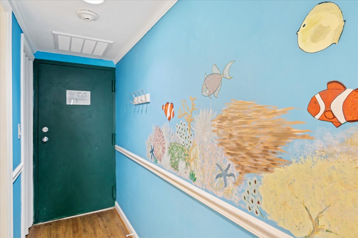 Enjoy the Bright & Fun Hand Painted Mural as you enter this Lovely Home.