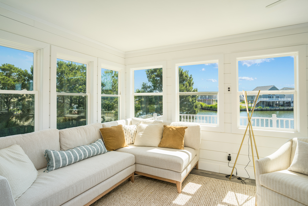 There's also a cozy Sunroom with breathtaking Water Views.