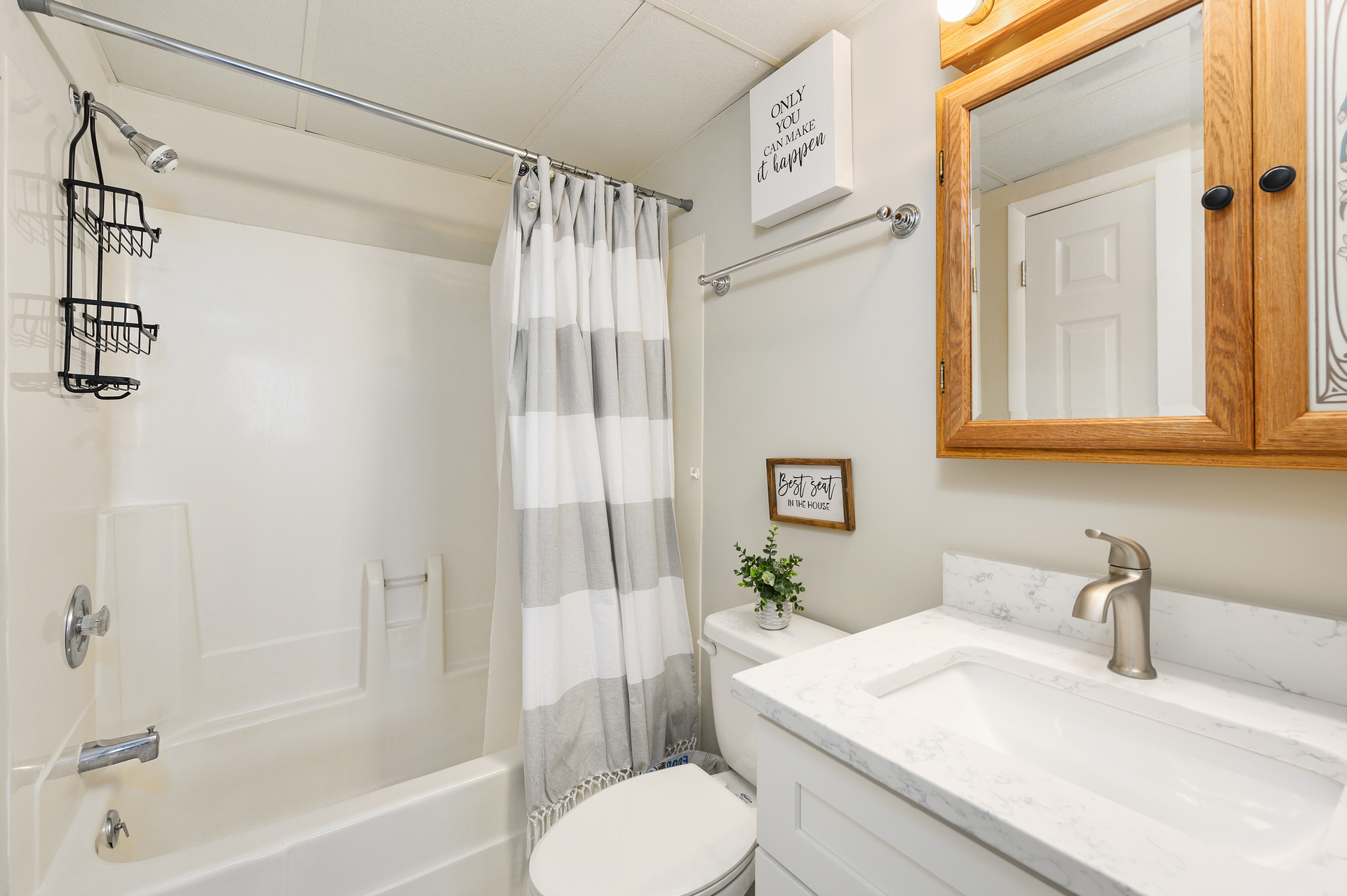 Beautifully remodeled bathroom with tub/shower combo and access from the bedroom or the hall
