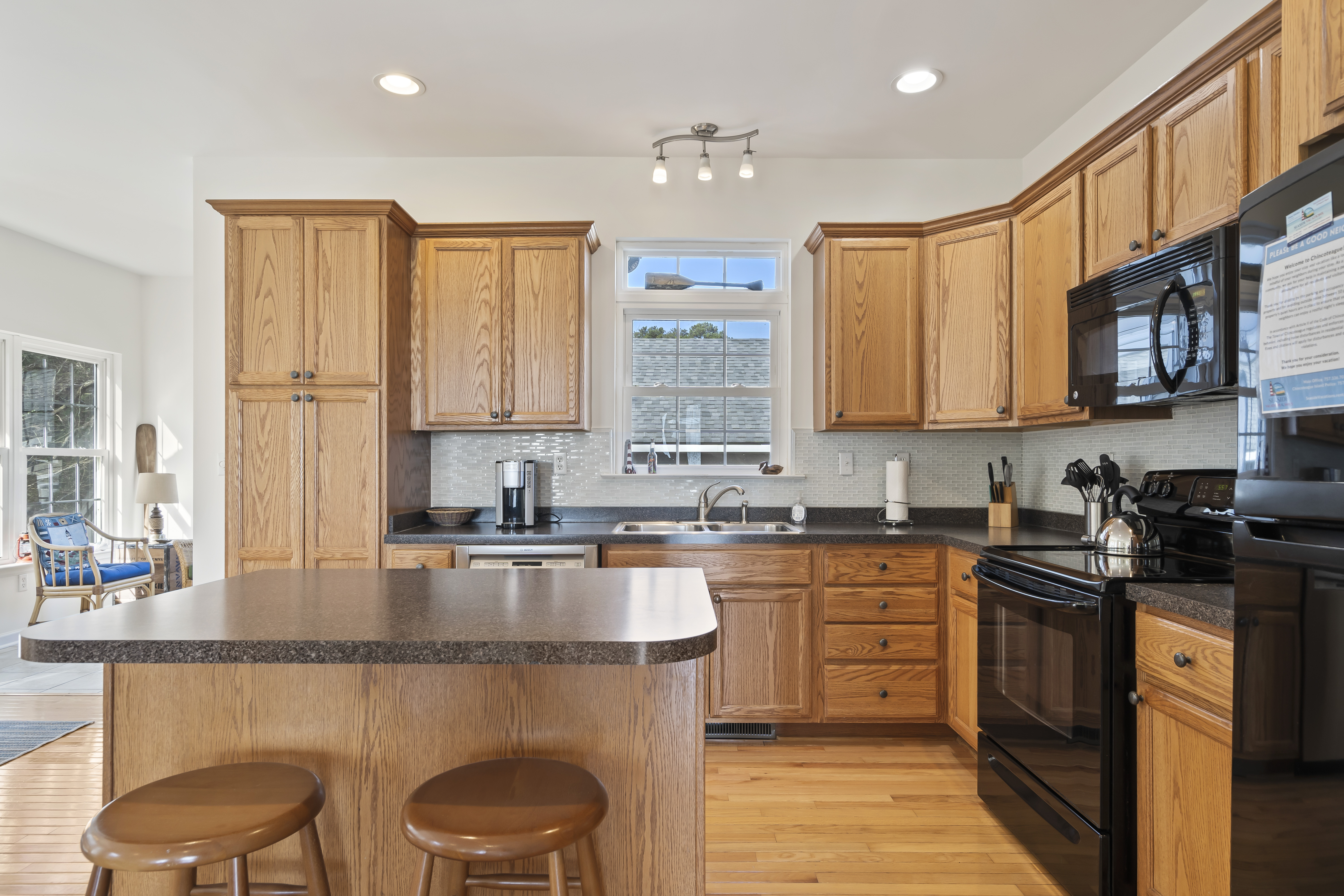 Warm wood Cabinets & lots of Countertop space.