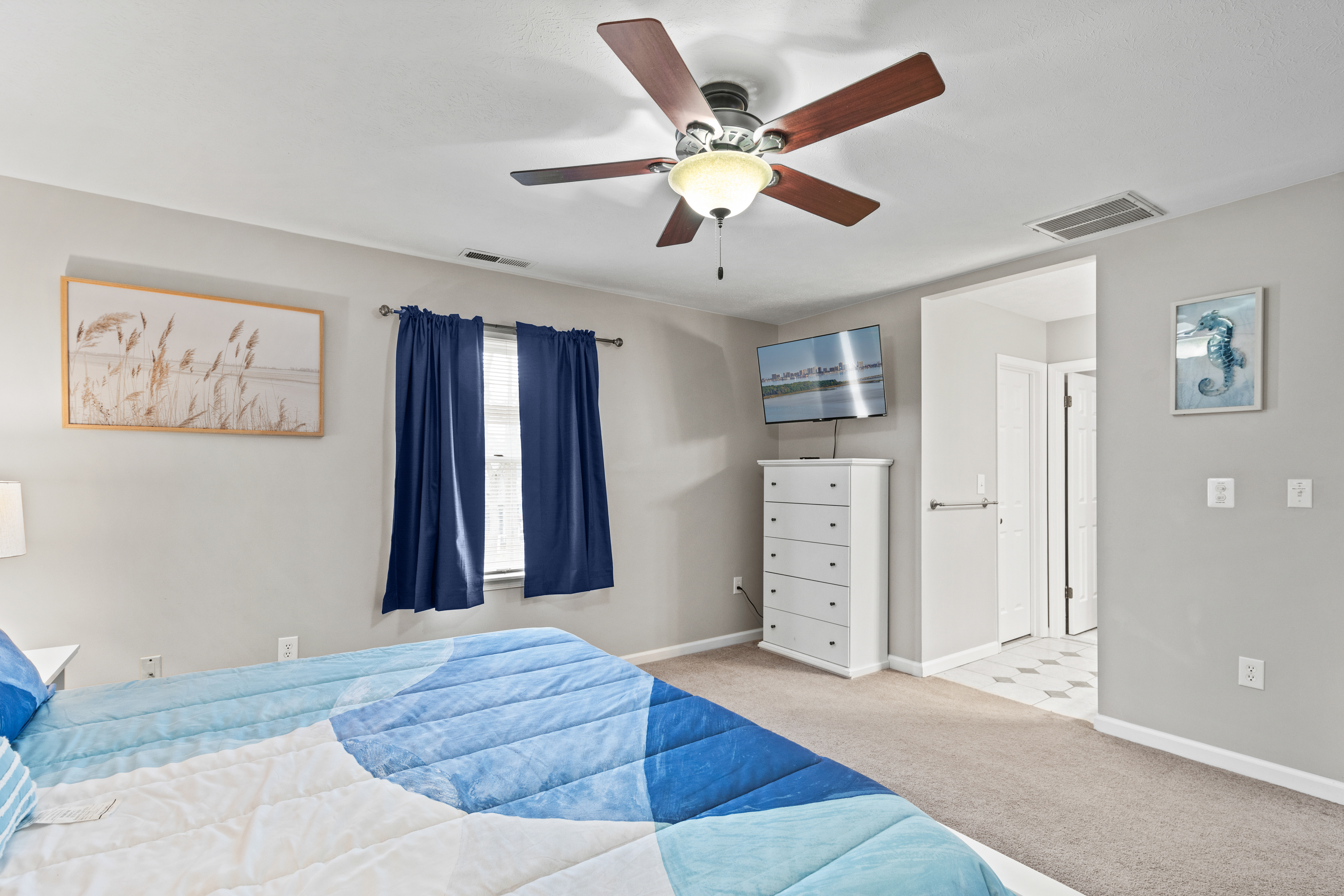 This relaxing room has a Flat Screen TV and ample Dresser space.