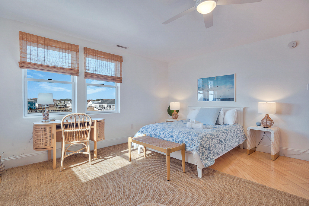 Master Bedroom with Queen Bed is adorned in beachy blues and has lovely Bay Views!