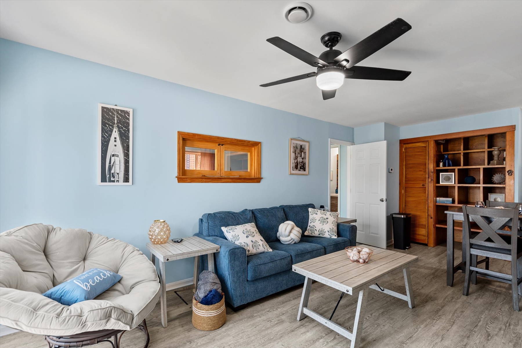 This wide perspective showcases the spacious and cohesive layout of the primary living space.