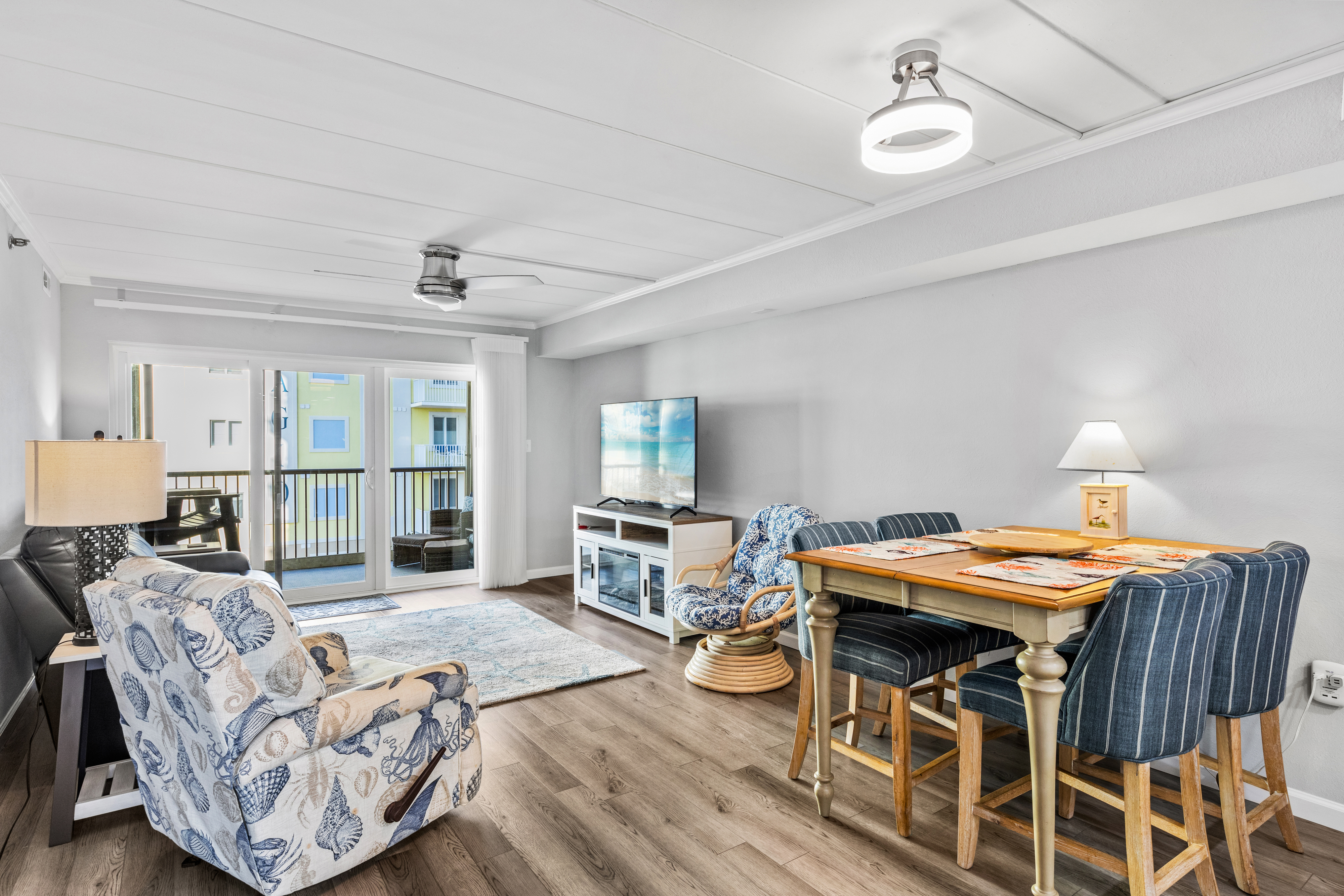 Plenty of natural light filters through the sliding glass doors to the balcony.