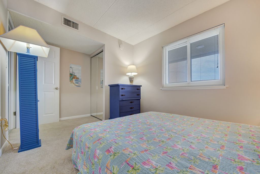 Relax and unwind in the plush Queen Bed