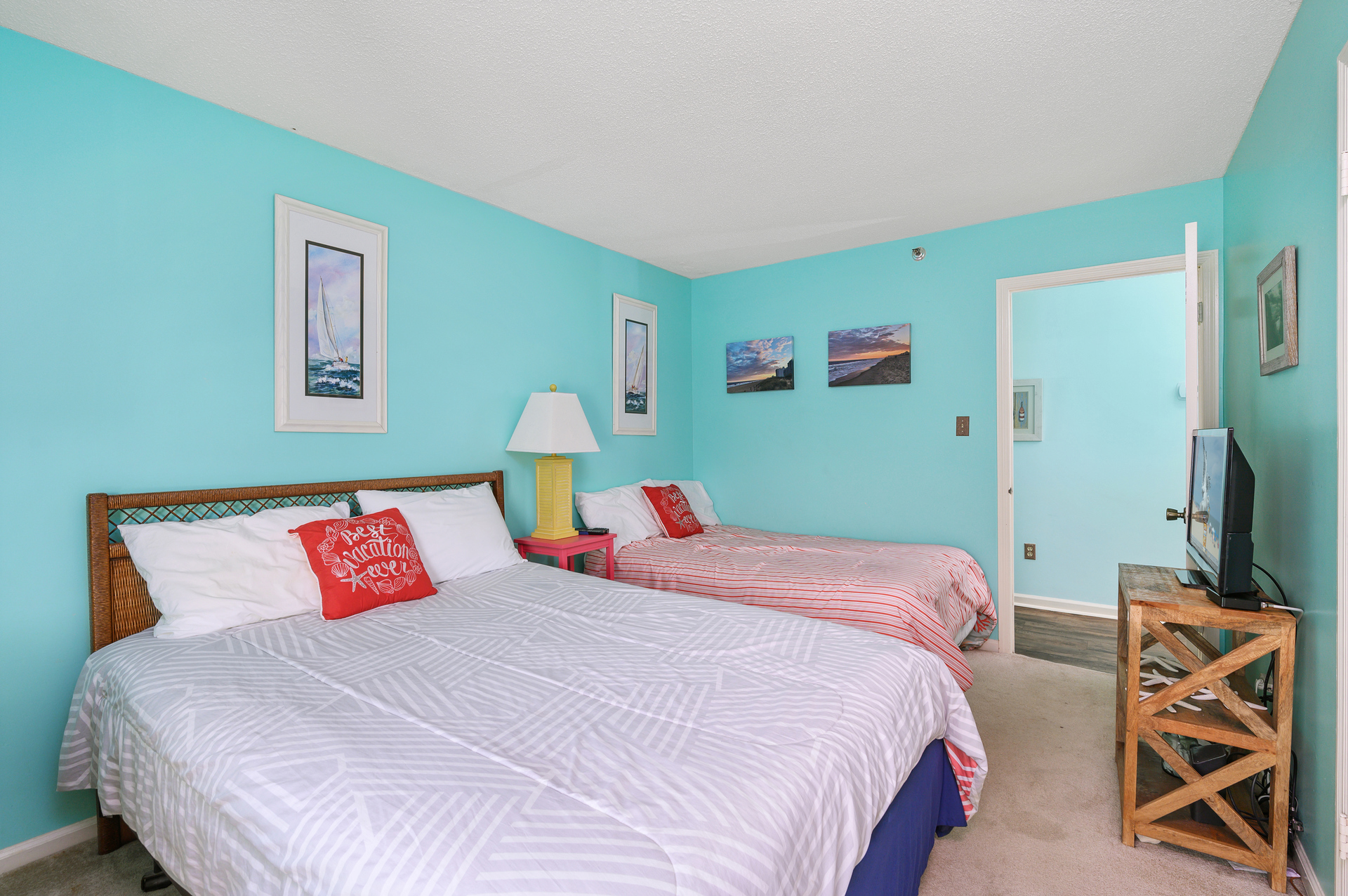 This bedroom offers a comfy queen and full bed.