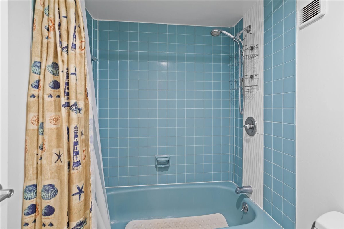 Rinse of the Warm Summer Sun & Sand in the Shower/Tub Combo.