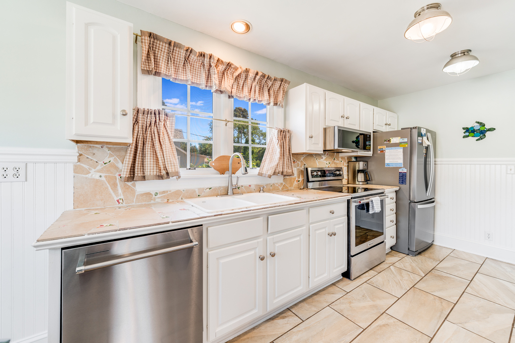 Truly unique with a Custom Back Splash created with Stone & Sea Glass.