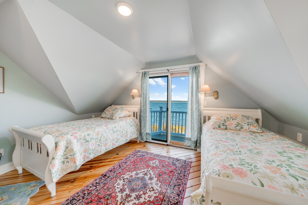 Follow the sunny yellow staircase upstairs to find Bedroom 2, also with 2 Twin Beds.