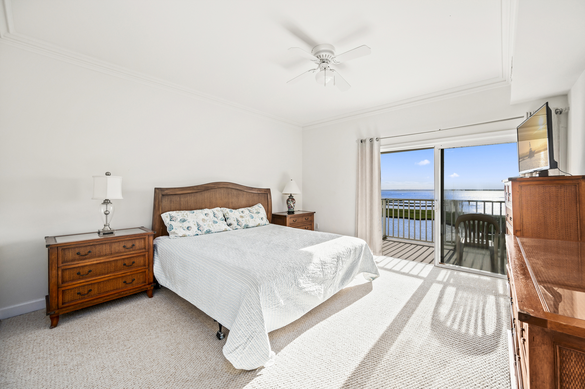 Bedroom 1 offers a King bed and views of the bay