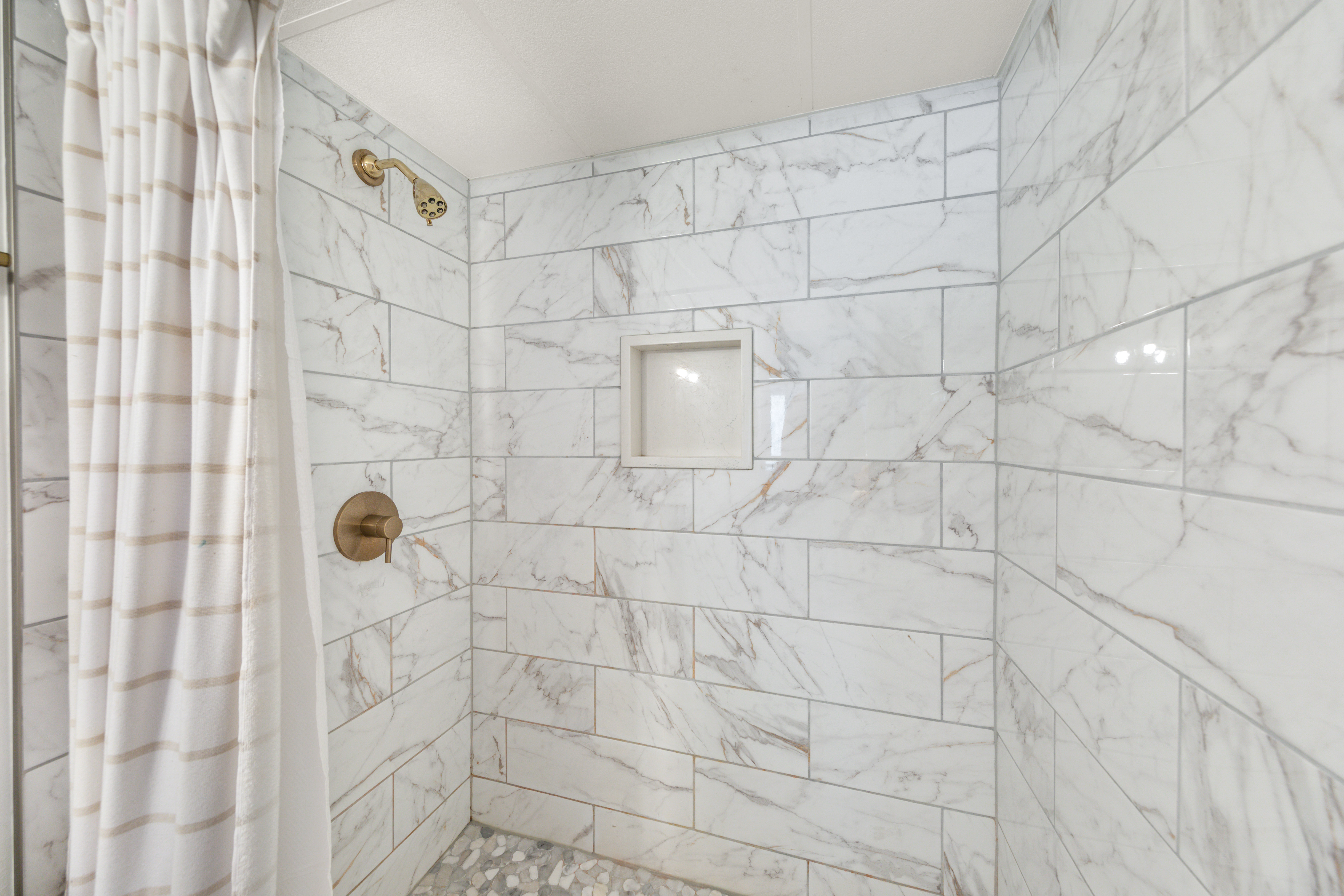 This Full Bath features a Custom-Tile Walk-In Shower.