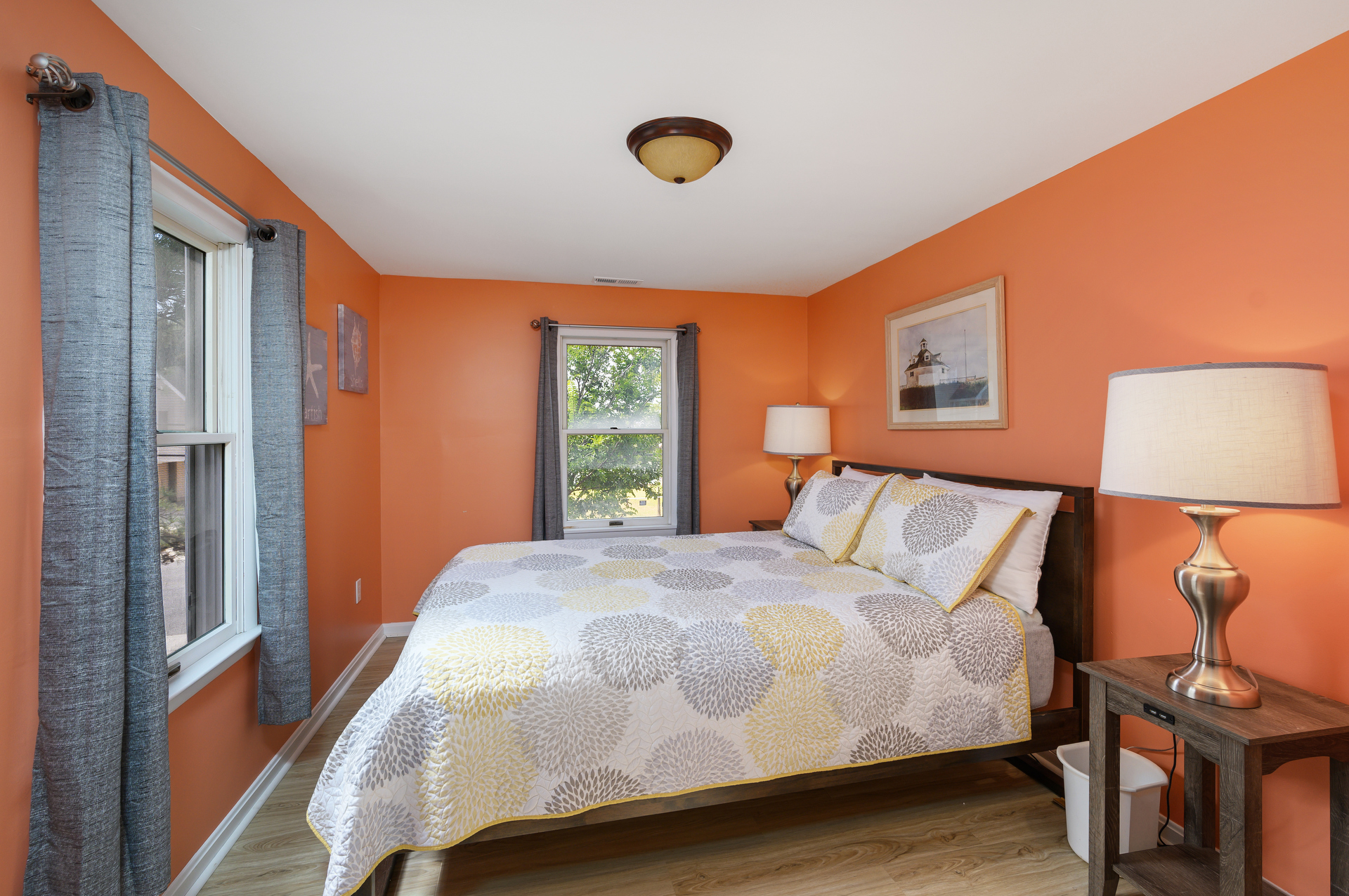 Bedroom 3 has cheerful decor and another Queen Bed.