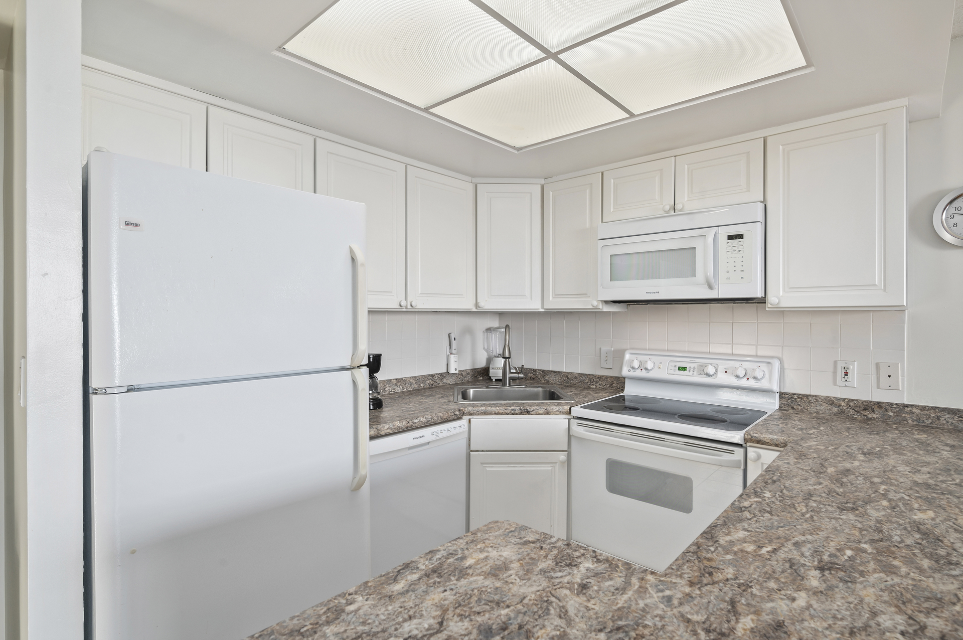 The Gleaming White Kitchen is a Chef's Dream, well-stocked with everything you'll need to make mealtime a breeze!