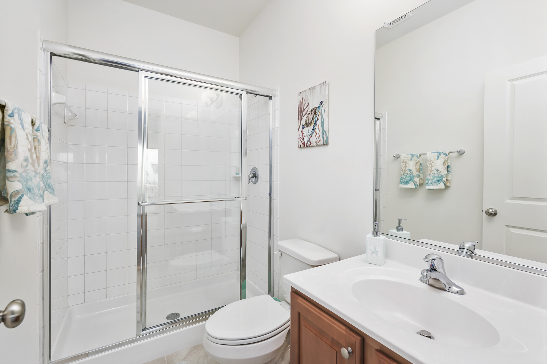 A 3rd Full Bath on the top floor has another Walk-in Shower.