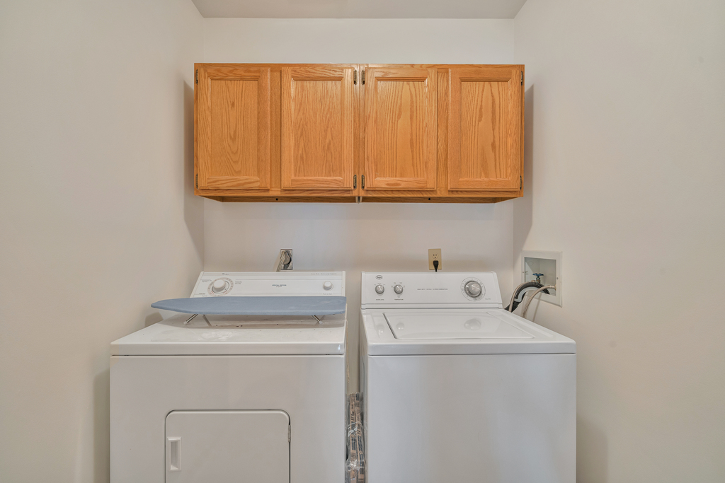 Upstairs Laundry with Full Size Washer and Dryer.