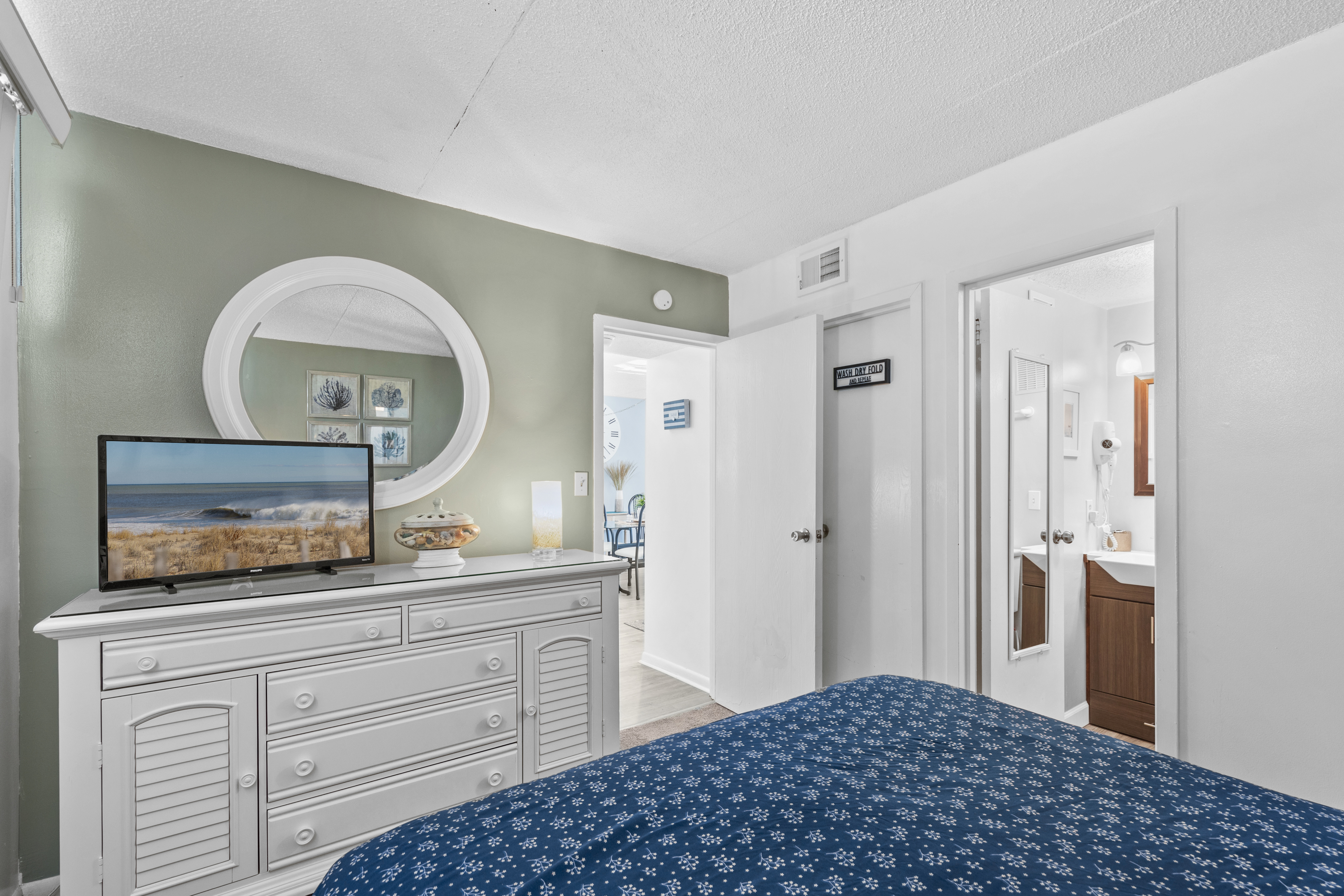 Bedroom 2 is home to another comfy Queen Bed and Flat Screen TV.