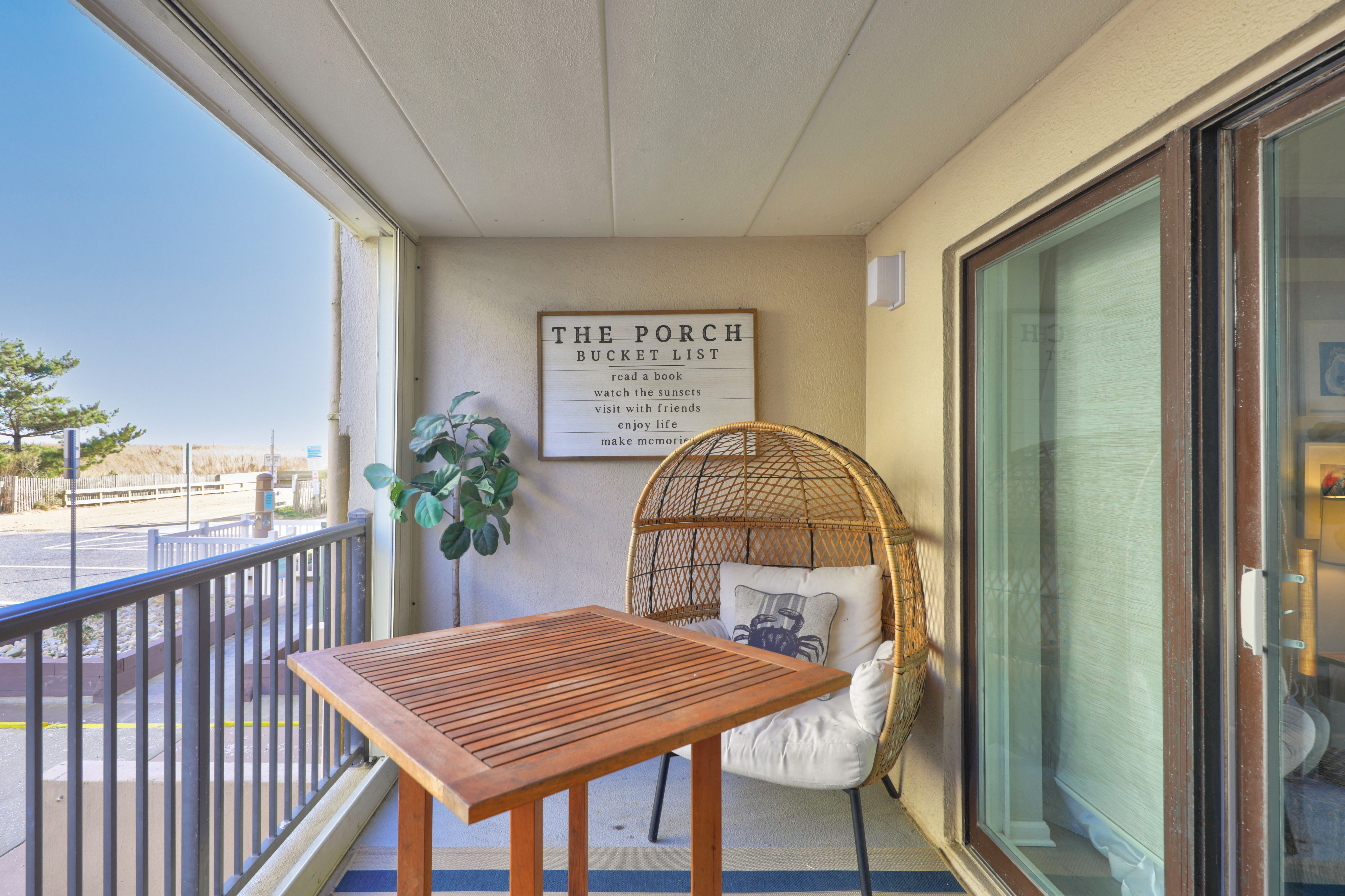 There are plenty of cozy furnishings to enjoy on this lovely balcony