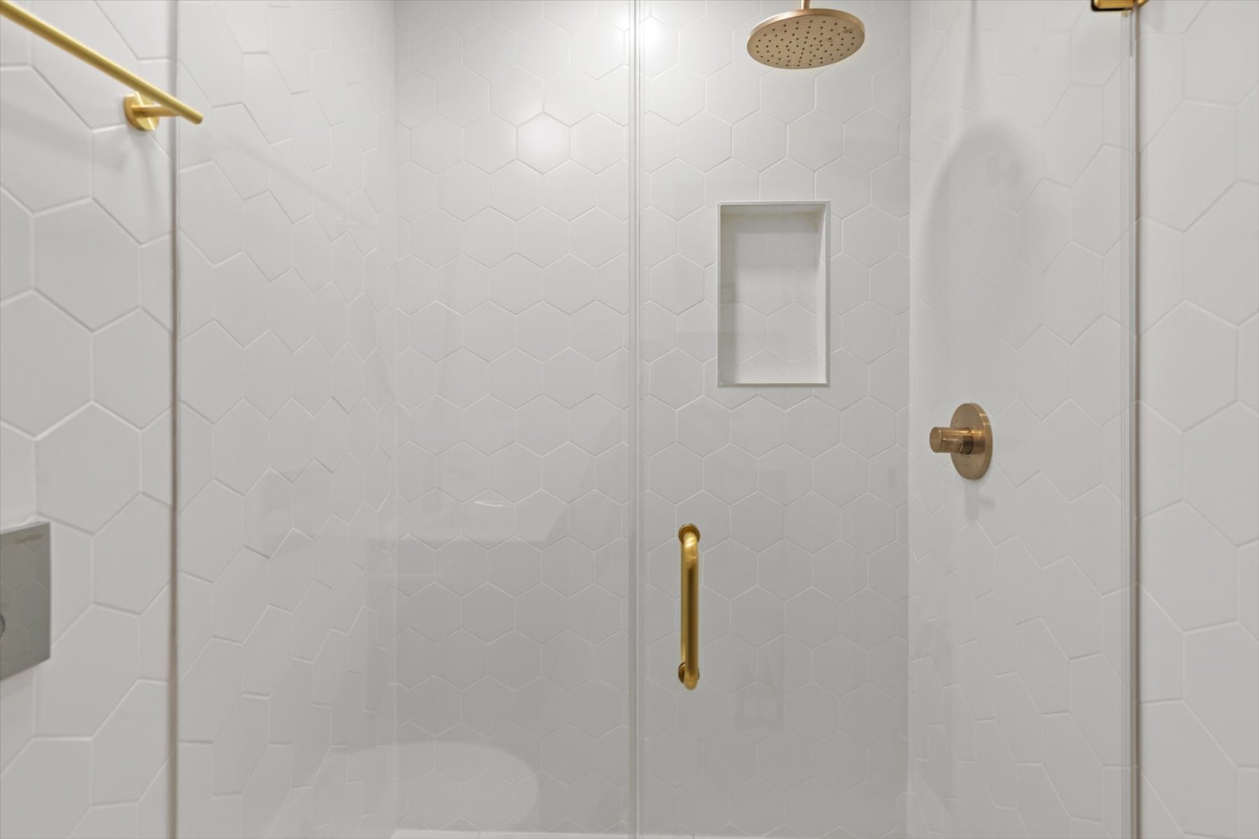 Custom-tile walk-in shower.