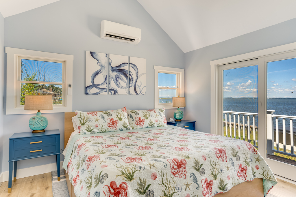 Bedroom 1 has a luxurious King Bed and Bay Views.