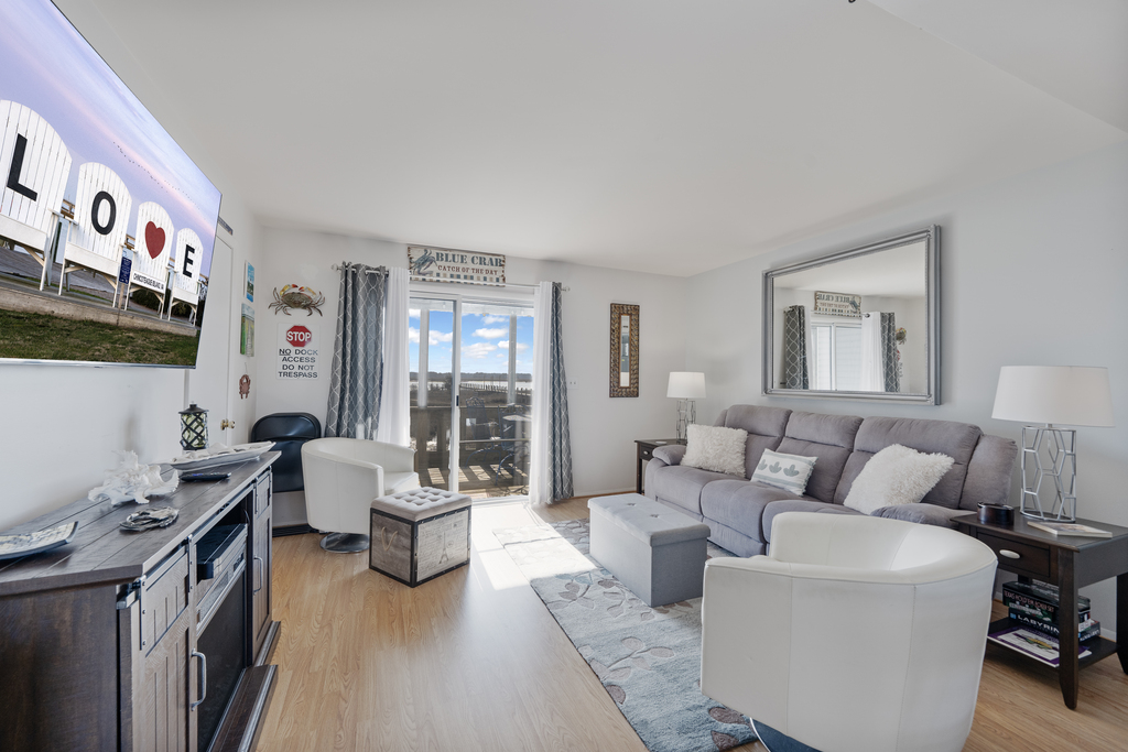 Relax in the Living Area after a fun-filled day at the Beach with Free WiFi and Flat Screen Streaming TV.