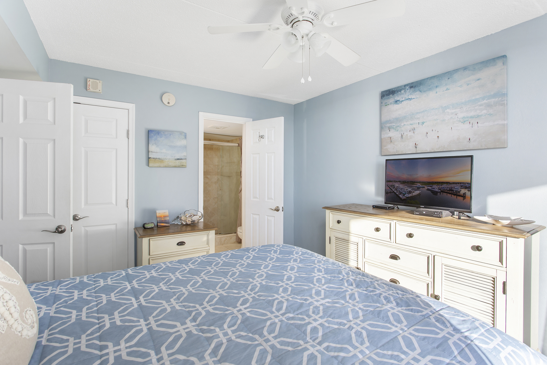 Rinse off the Summer Sun in the Spa-Like Primary Bathroom.