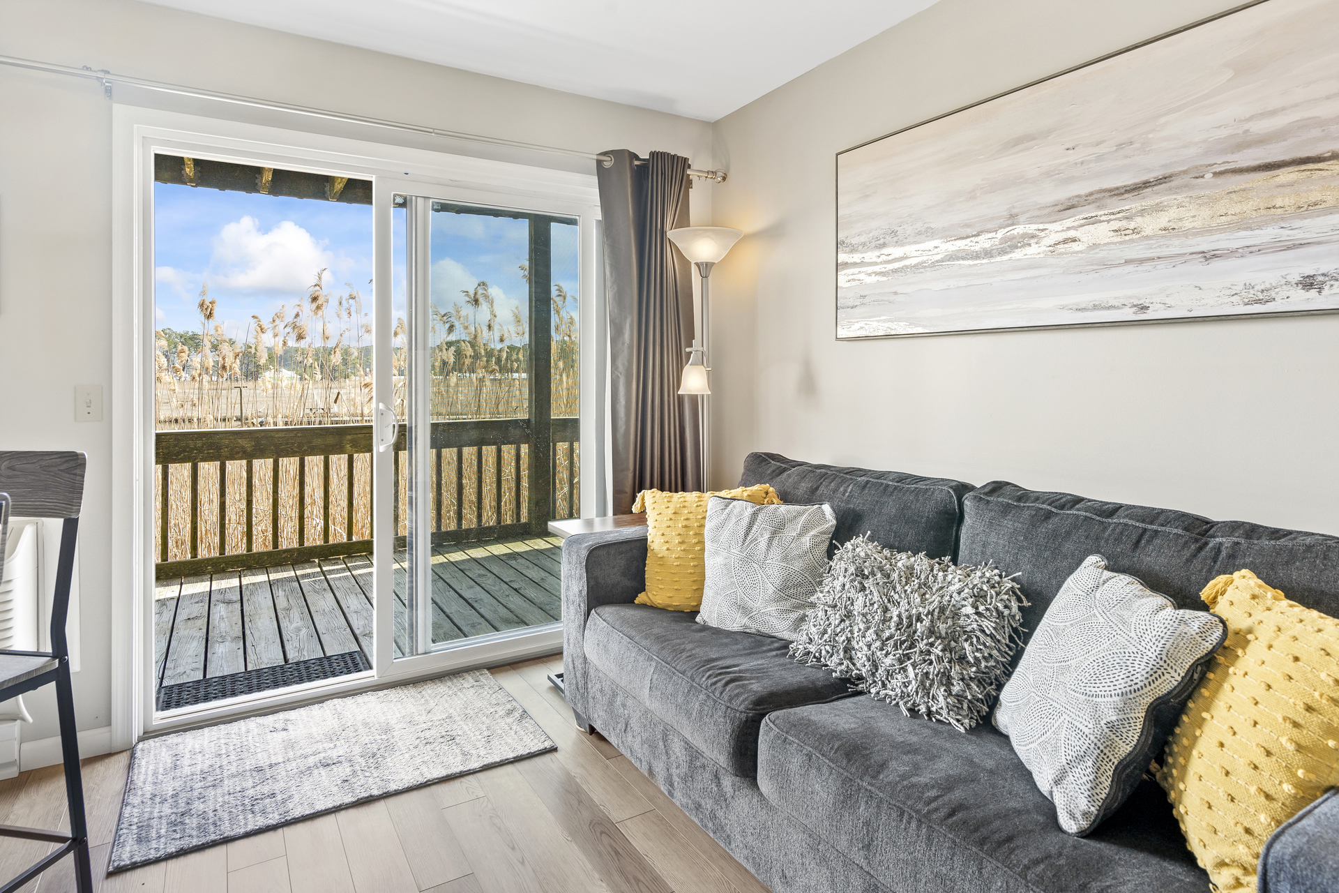 Living Area has Sleeper Sofa and serene Views.