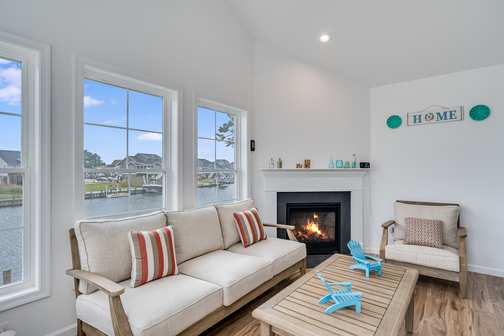 Gorgeous Sunroom with Gas Fireplace for those chilly off season stays.