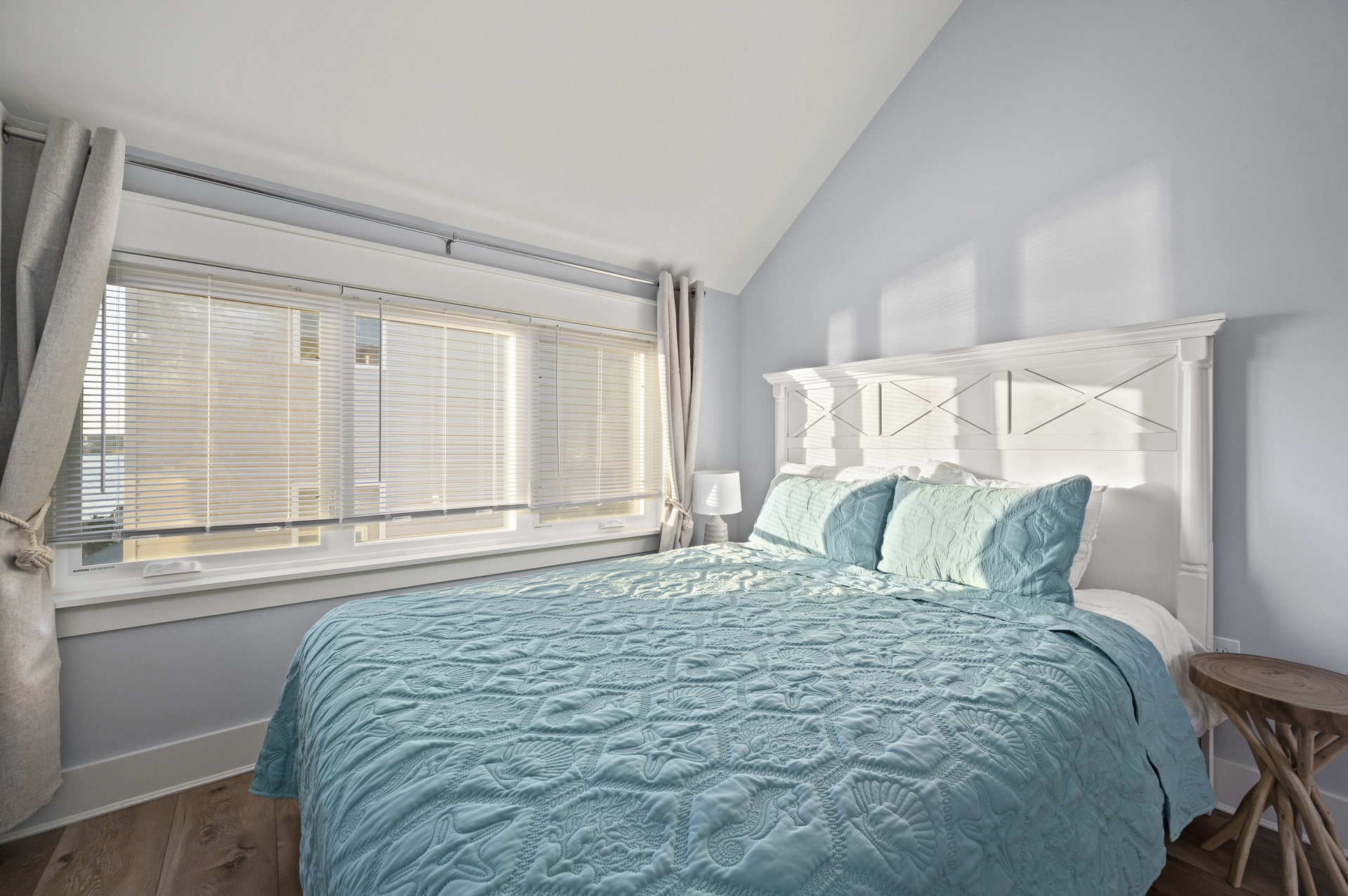 This gorgeous Bedroom has a Queen Bed and lovely views.