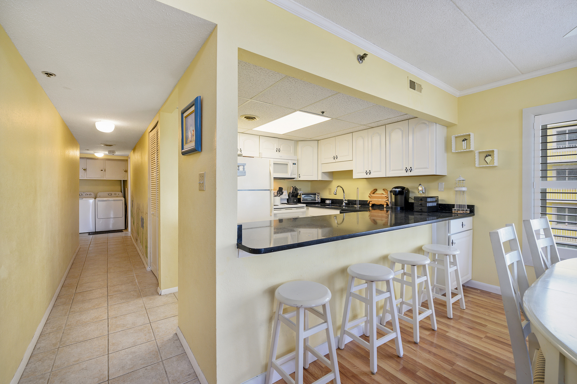 The kitchen's breakfast bar. Perfect for grabbing a quick bite on your way out the door!
