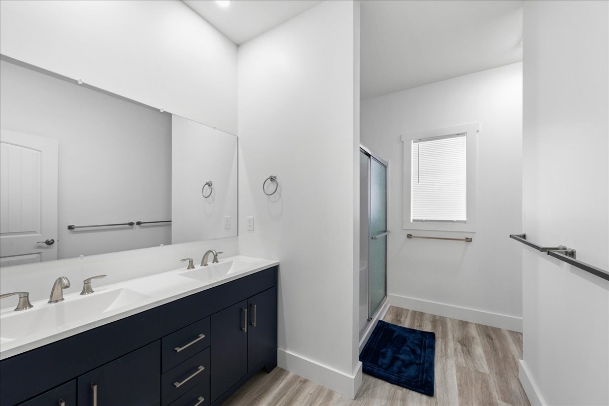 Attached Full Bath with gorgeous blue Double Vanity.