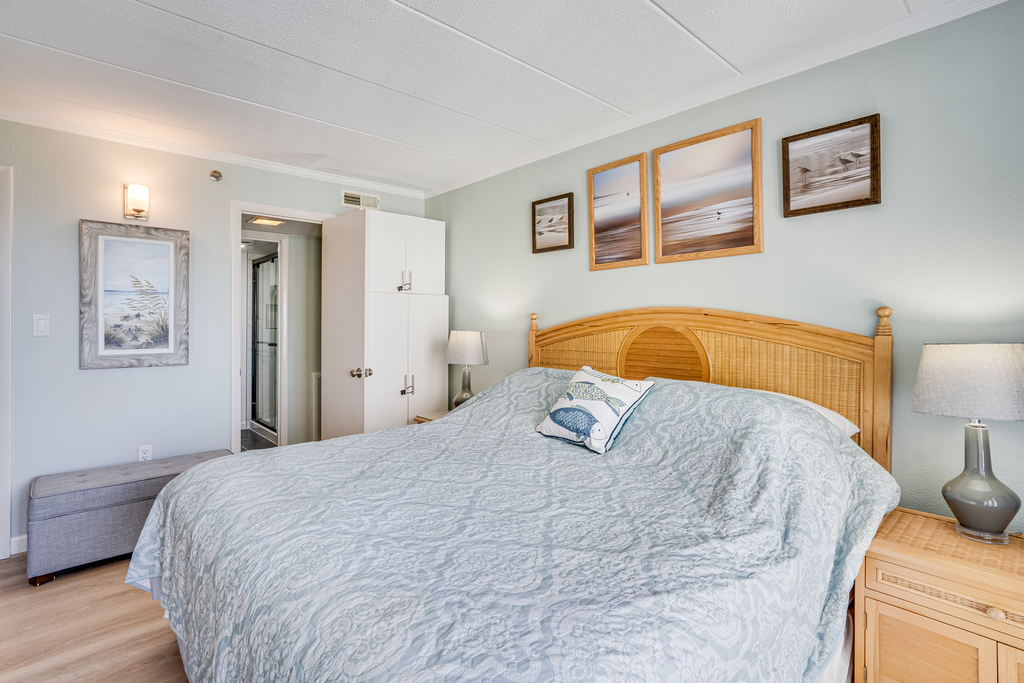 The Primary Bedroom has Natural Light and a snug King Bed.