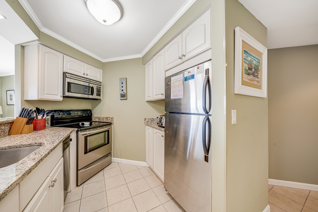 Gleaming white cabinetry and Stainless-Steel appliances throughout!
